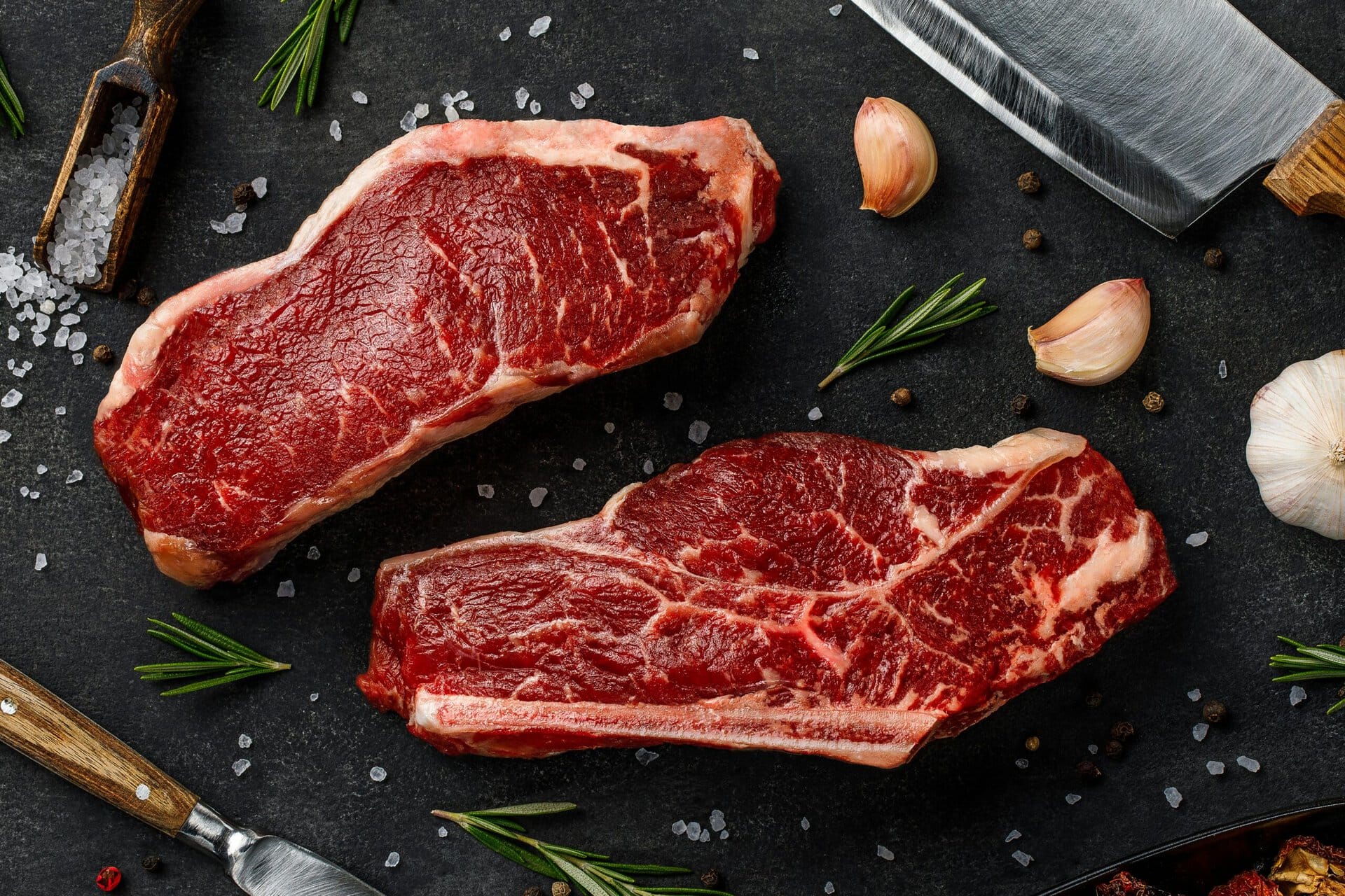 High-quality raw beef steaks with marbling, ready for cooking. Perfect for grilling, searing, or bro.
